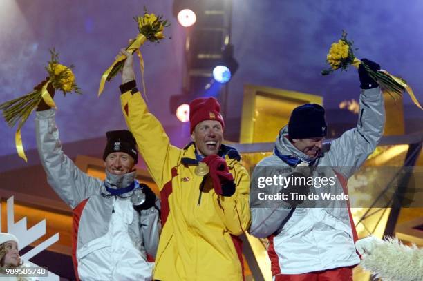 Winter Olympic Games : Salt Lake City, Men'S 30Km Free Cross-Country Gold Medalist Johann Muehlegg Of Spain Is Flanked By Silver Medalist Christian...