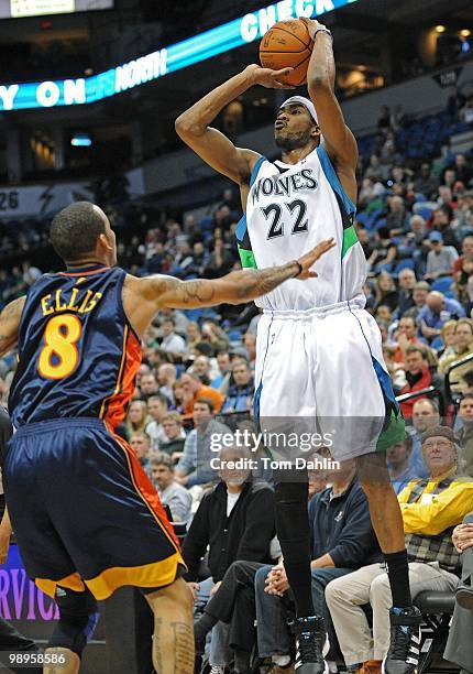 Corey Brewer of the Minnesota Timberwolves shoots a jump shot against Monta Ellis of the Golden State Warriors during the game on January 6, 2010 at...