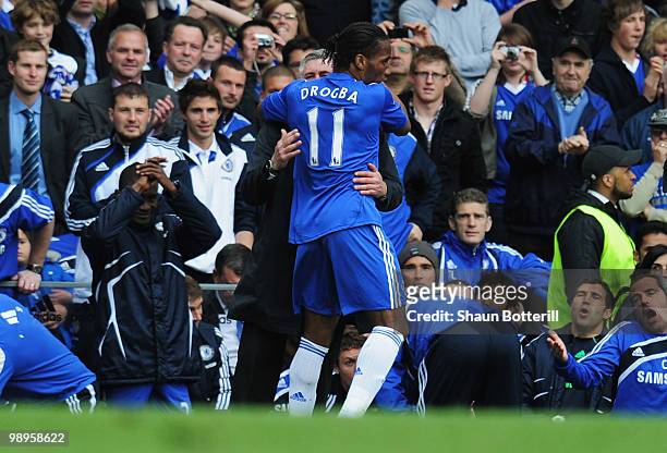 Didier Drogba of Chelsea embraces manager Carlo Ancelotti during the Barclays Premier League match between Chelsea and Wigan Athletic at Stamford...