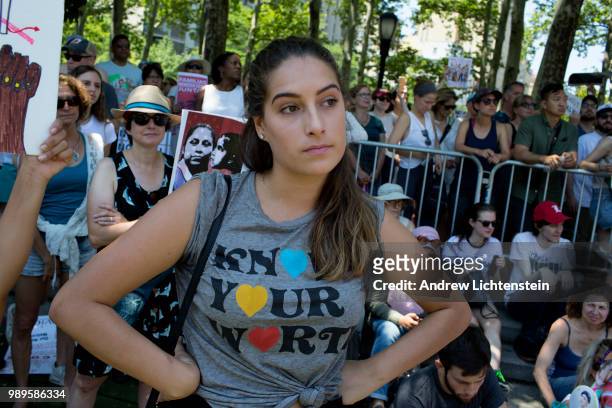 Demonstrators gather in Brooklyn as part of a national "Families Belong Together" rallies across the country to protest the Trump administration's...