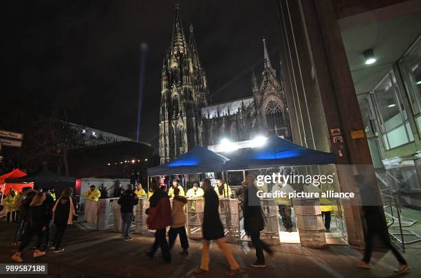 Security checkpoints surround the area nest to the cathedral in Cologne, Germany, 31 December 2017. Great measures of security were taken this year...