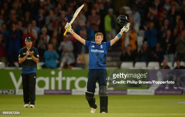 Joe Root of England celebrates after reaching his century during his innings of 106 not out as Ross Taylor of New Zealand applauds in the 4th Royal...