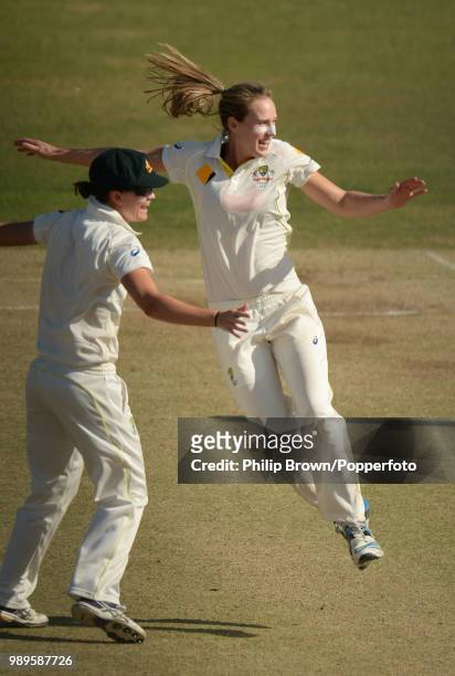 Ellyse Perry of Australia celebrates with teammate Jess Jonassen after dismissing Lydia Greenway of England during the Women's Ashes Test match...
