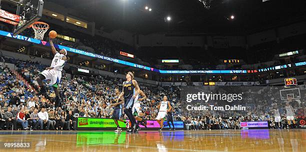 Jonny Flynn of the Minnesota Timberwolves shoots a layup against Chris Andersen of the Denver Nuggets during the game on November 25, 2009 at the...