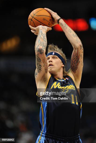 Chris Andersen of the Denver Nuggets shoots against the Minnesota Timberwolves during the game on November 25, 2009 at the Target Center in...