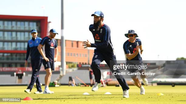 Moeen Ali and David Willey of England warm up during a net session at Emirates Old Trafford on July 2, 2018 in Manchester, England.