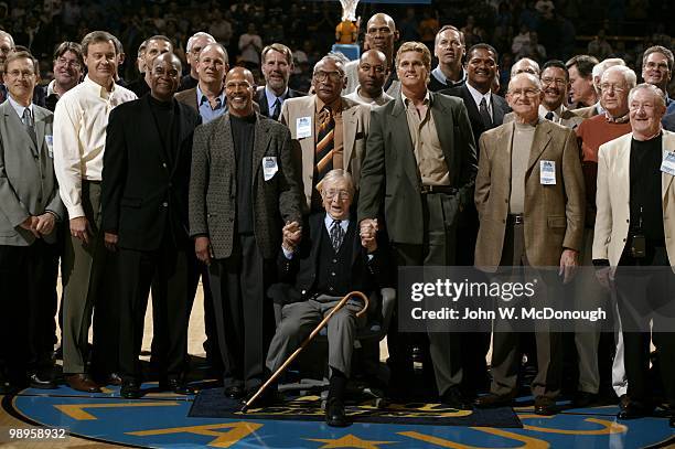 Former UCLA head coach John Wooden with former players before game vs Michigan State. Wooden was honored at Pauley Pavilion with the court being...