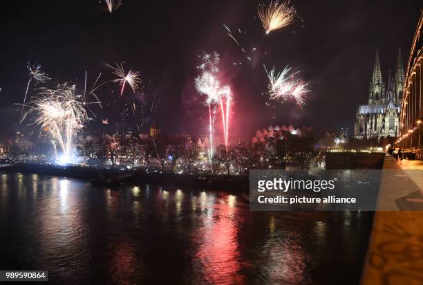 Fireworks light up thew sky over the skyline in Cologne, Germany, 31 December 2017. Great measures of security were taken during the festivities of...
