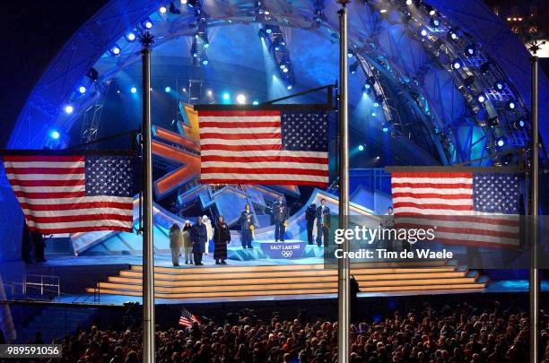 Winter Olympic Games : Salt Lake City, 2/11/02, Salt Lake City, Utah, United States --- Three American Flags Are Raised As Medals Are Awarded To...