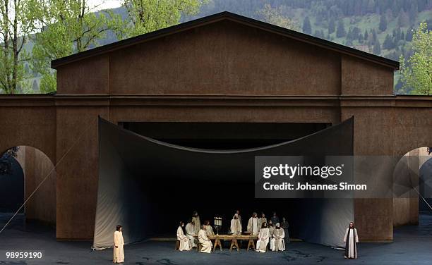 Frederik Mayet as Jesus Christ and ensemble members perform the scene of the Last Supper on stage during the Oberammergau passionplay 2010 final...