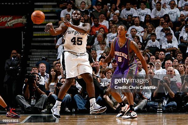 DeJuan Blair of the San Antonio Spurs passes the ball away from Channing Frye of the Phoenix Suns in Game Three of the Western Conference Semifinals...