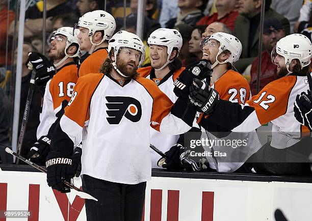 Scott Hartnell of the Philadelphia Flyers is congratulated by teammate Simon Gagne after Hartnell scored in the first period against the Boston...