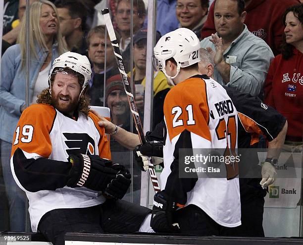 Scott Hartnell of the Philadelphia Flyers is tended to after a high stick by Vladimir Sobotka of the Boston Bruins cut his eye in Game Five of the...