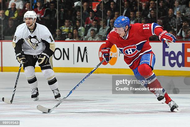 Mike Cammalleri of Montreal Canadiens skates with the puck infront of Chris Kunitz of the Pittsburgh Penguins in Game Six of the Eastern Conference...