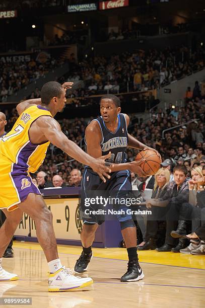 Miles of the Utah Jazz looks to move the ball against Ron Artest of the Los Angeles Lakers at Staples Center on April 2, 2010 in Los Angeles,...