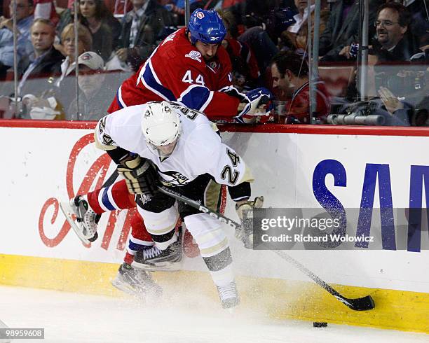 Roman Hamrlik of the Montreal Canadiens body checks Matt Cooke of the Pittsburgh Penguins in Game Six of the Eastern Conference Semifinals during the...