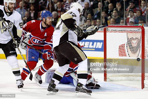 Sidney Crosby of the Pittsburgh Penguins scores a goal on Jaroslav Halak of the Montreal Canadiens in Game Six of the Eastern Conference Semifinals...