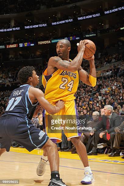 Kobe Bryant of the Los Angeles Lakers looks to pass the ball against Ronnie Price of the Utah Jazz at Staples Center on April 2, 2010 in Los Angeles,...