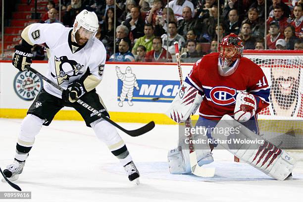 Pascal Dupuis of the Pittsburgh Penguins attempts to deflect the puck in front of Jaroslav Halak of the Montreal Canadiens in Game Six of the Eastern...