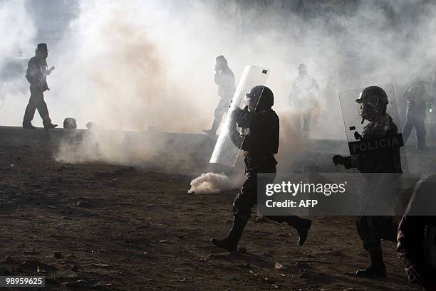 Ecuadorean natives clash with the police in Guachala, some 30 km from Quito, on May 10, 2010 in protest of a proposed water privatization measure...