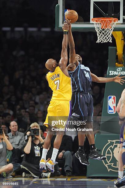 Paul Millsap of the Utah Jazz tips the ball against Lamar Odom of the Los Angeles Lakers at Staples Center on April 2, 2010 in Los Angeles,...