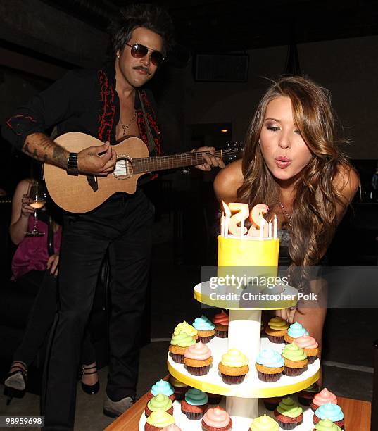 Ryan Cabrera watches as Audrina Patridge blows out the candles during her 25th birthday at Las Palmas Latin Supper Club on May 9, 2010 in Hollywood,...