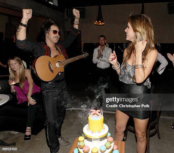 Ryan Cabrera watches as Audrina Patridge blows out the candles during her 25th birthday at Las Palmas Latin Supper Club on May 9, 2010 in Hollywood,...