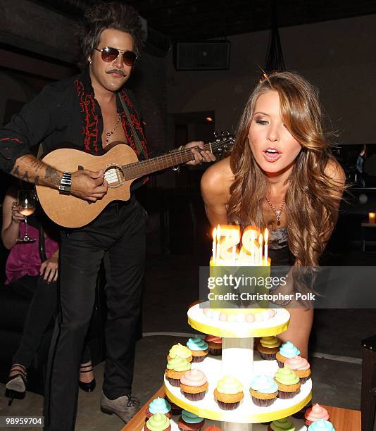 Ryan Cabrera watches as Audrina Patridge blows out the candles during her 25th birthday at Las Palmas Latin Supper Club on May 9, 2010 in Hollywood,...