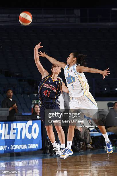 Kristi Toliver of the Chicago Sky battles for the ball with Tully Bevilaqua of the Indiana Fever during the WNBA pre season game on May 10, 2010 at...