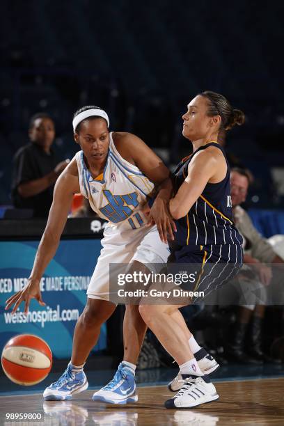 Jia Perkins of the Chicago Sky is gaurded by Tully Bevilaqua of the Indiana Fever during the WNBA pre season game on May 10, 2010 at the All-State...