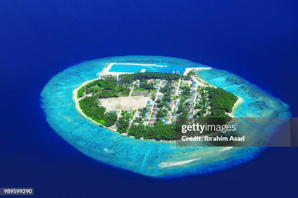 aerial view of tropical island, kaafu, maldives - island aerial stock pictures, royalty-free photos & images