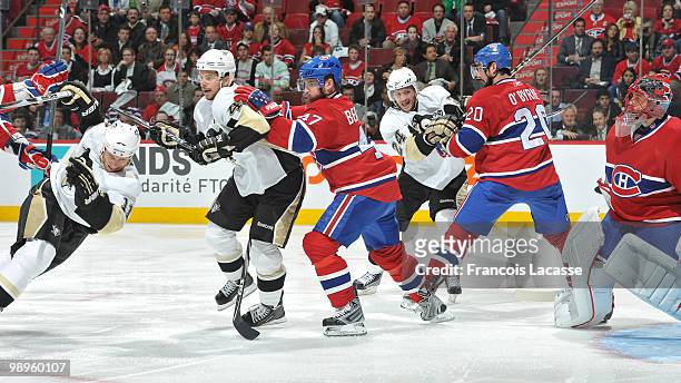 Marc-Andre Bergeron of Montreal Canadiens pushes Brooks Orpik of the Pittsburgh Penguins in Game Six of the Eastern Conference Semifinals during the...