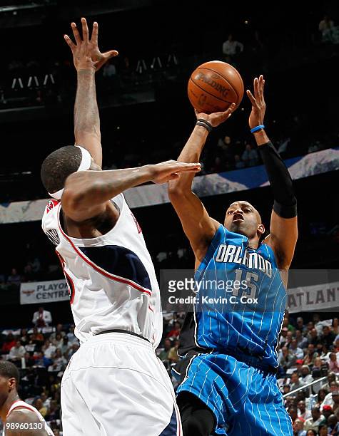 Vince Carter of the Orlando Magic shoots against Josh Smith of the Atlanta Hawks during Game Four of the Eastern Conference Semifinals of the 2010...