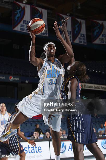 Sylvia Fowles of the Chicago Sky goes to the basket over Josephine Owino of the Indiana Fever during the WNBA pre season game on May 10, 2010 at the...