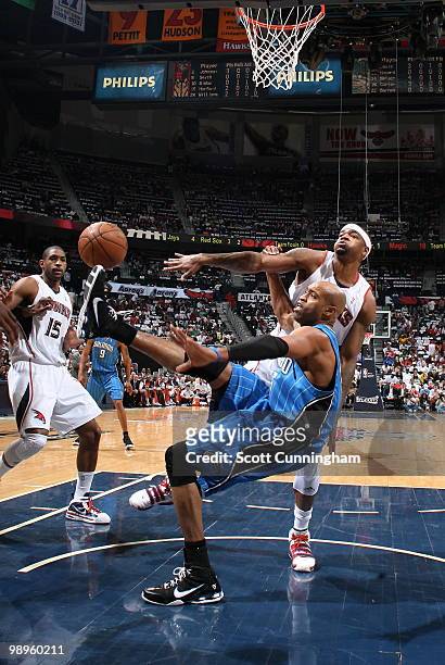 Vince Carter of the Orlando Magic is defended by Josh Smith of the Atlanta Hawks in Game Four of the Eastern Conference Semifinals during the 2010...