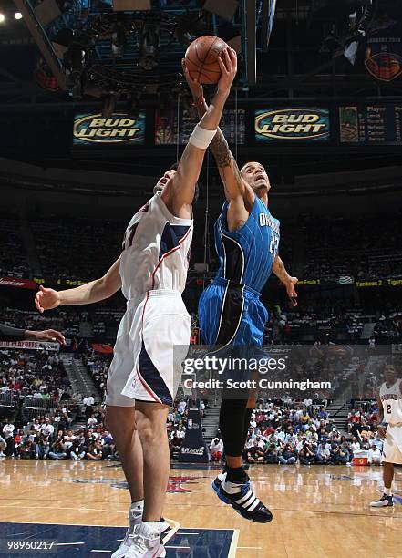 Matt Barnes of the Orlando Magic battles for a rebound against Zaza Pachulia of the Atlanta Hawks in Game Four of the Eastern Conference Semifinals...