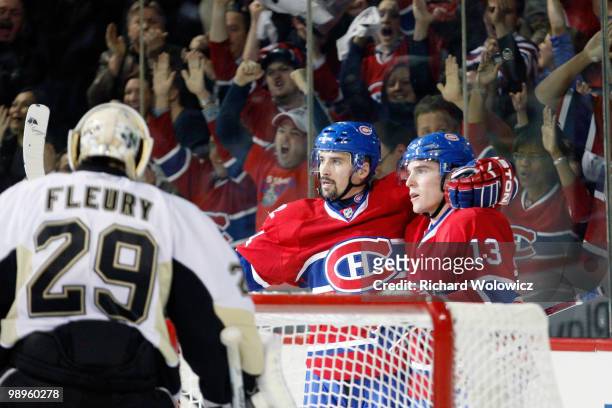 Mike Cammalleri of the Montreal Canadiens celebrates his second-period goal with teammate Tomas Plekanec in Game Six of the Eastern Conference...