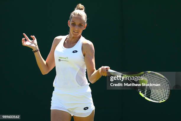 Kristyna Pliskova of Czech Republic returns to Alexandra Dulgheru of Romania during during their Ladies' Singles first round match on day one of the...