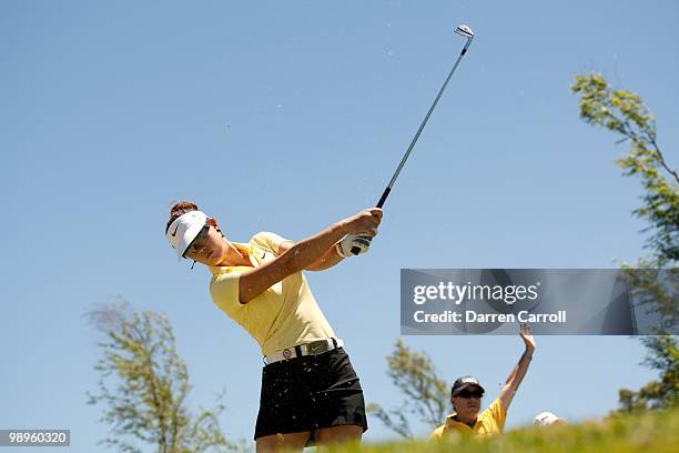 Michelle Wie follows through on a tee shot during the third round of the Tres Marias Championship at the Tres Marias Country Club on May 1, 2010 in...