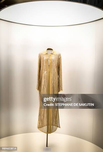 This photo taken on July 2, 2018 shows a creation displayed at the exhibition "L'Alchimie Secrete d'Une Collection" by late French-Tunisian fashion...