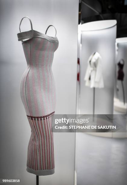 This photo taken on July 2, 2018 shows a creation displayed at the exhibition "L'Alchimie Secrete d'Une Collection" by late French-Tunisian fashion...