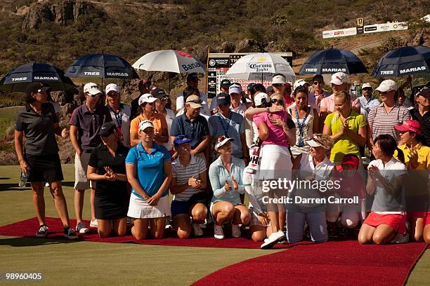 Morgan Pressel embraces Lorena Ochoa of Mexicoas other LPGA players look on following the fourth round of the Tres Marias Championship at the Tres...