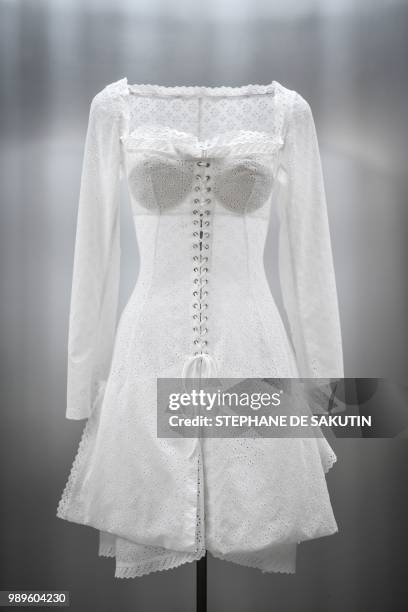 This photo taken on July 2, 2018 shows a creation displayed at the exhibition "L'Alchimie Secrete d'Une Collection" by late French-Tunisian fashion...
