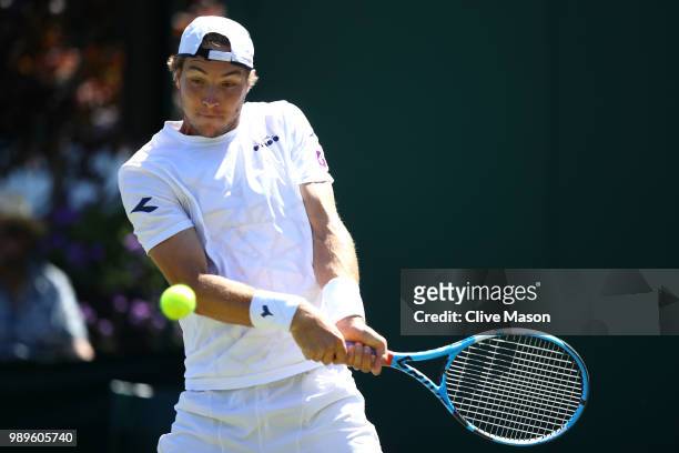 Jan-Lennard Struff of Germany returns to Leonardo Mayer of Argentina during their Men's Singles first round match on day one of the Wimbledon Lawn...