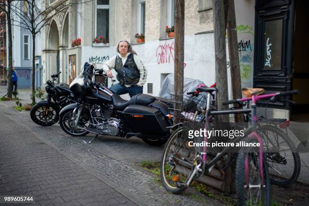 The founder of the biker club 'Recondo Vets MMC', Ralf Bartzsch alias Muerte, poses for a portrait in front of the club house in Berlin, Germany, 7...