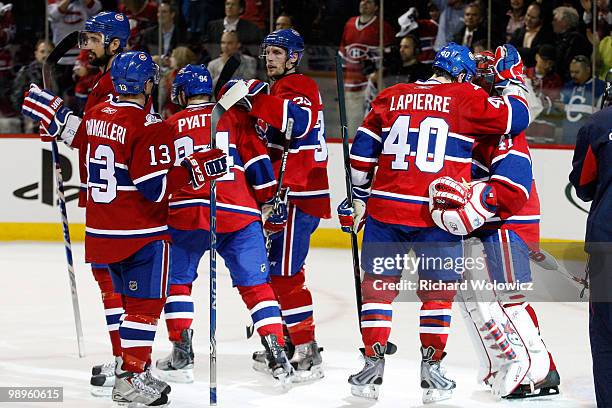 Members of the Montreal Canadiens celebrate a victory over the Pittsburgh Penguins in Game Six of the Eastern Conference Semifinals during the 2010...