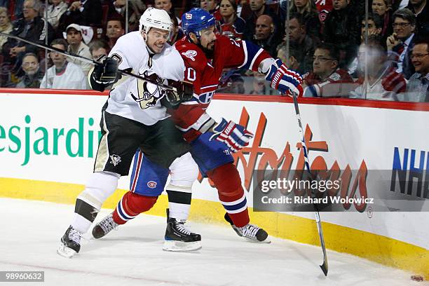 Tyler Kennedy of the Pittsburgh Penguins body checks Ryan O'Byrne of the Montreal Canadiens in Game Six of the Eastern Conference Semifinals during...