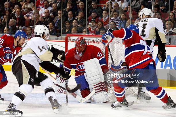 Jaroslav Halak of the Montreal Canadiens stops the puck on an attempt by Jordan Staal of the Pittsburgh Penguins in Game Six of the Eastern...