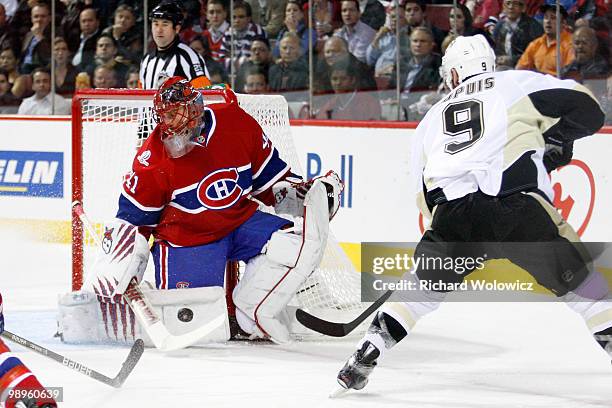 Jaroslav Halak of the Montreal Canadiens stops the puck on a shot from Pascal Dupuis of the Pittsburgh Penguins in Game Six of the Eastern Conference...