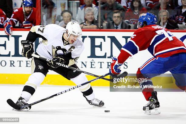 Sidney Crosby of the Pittsburgh Penguins stick-handles the puck against P.K. Subban of the Montreal Canadiens in Game Six of the Eastern Conference...